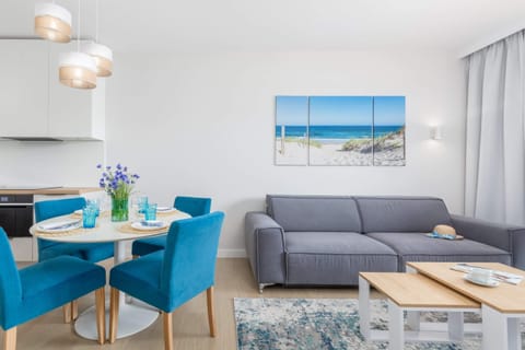 A different perspective of the dining and living area, highlighting decorative touches and ample natural light.