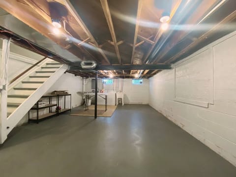 Huge basement with full washer and dryer and table to iron and fold.