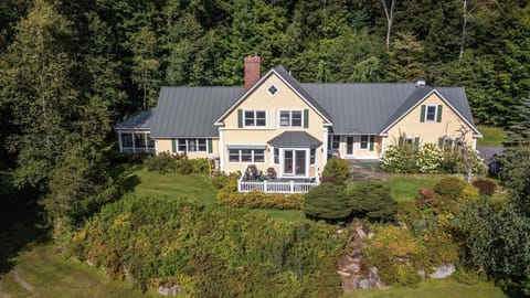 Beautiful home, perched on a hillside with extensive gardens