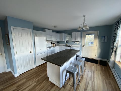 Stocked kitchen with island seating
