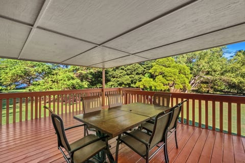 Lanai area is surrounded by lush greenery