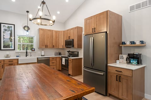 The kitchen includes custom touches such as the coffee bar