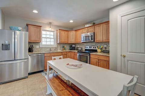 Stainless Appliances and Warm Wood Cabinetry.