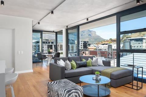 Exclusive Apartment | Living area | 50-inch flat-screen TV with cable channels, TV, streaming services