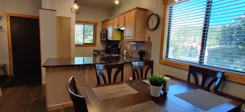 Dining table fits 6 and has a leaf for expansion.  Folding chairs available