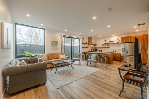Open-concept living space with comfortable seating and easy access to the kitchen