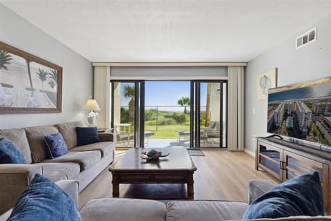 Start your morning with coffee and coastal views from this comfy living room that opens directly to the beach.