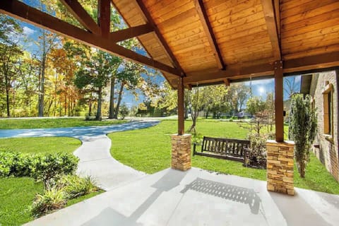 Enjoy coffee on this beautiful porch, relaxing on the porch swing!