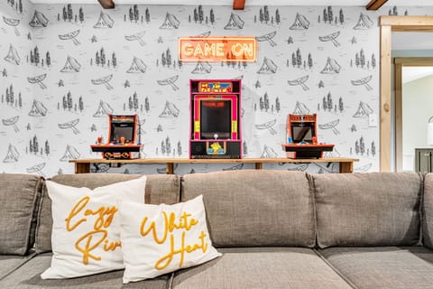 A fun-filled family playroom equipped with arcades, a large TV, and an Xbox for endless entertainment and quality time together.