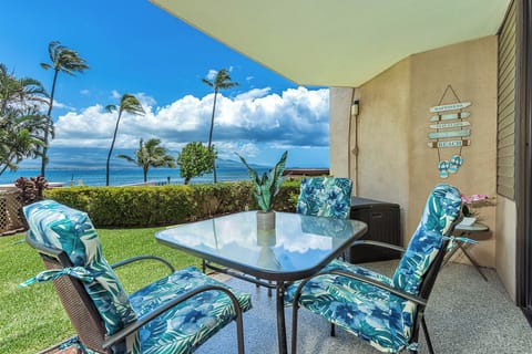 Your private lanai overlooks swaying palms and sparkling ocean views. Settle into cushioned seating with your morning coffee and feel the warm tropical breeze as island clouds drift by.
