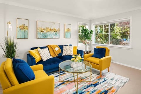 This sun-drenched living room (with bold blue-and-yellow decor) feels like a cozy escape—ideal for unwinding after exploring the city.