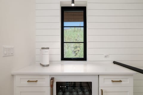 On the upper floor, you'll discover a cozy kitchenette, perfect for brewing your morning coffee with the Keurig.