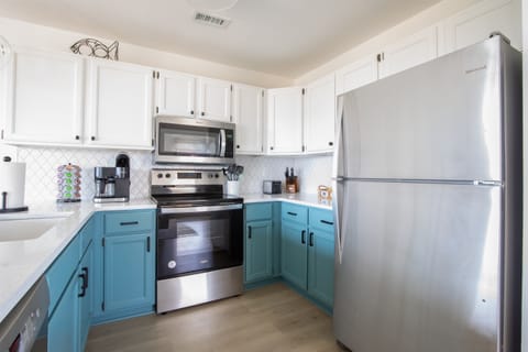 Fully stocked coastal kitchen with modern finishes