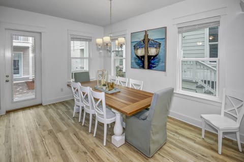 Large farm style dining table with seating for up to 10 guests
