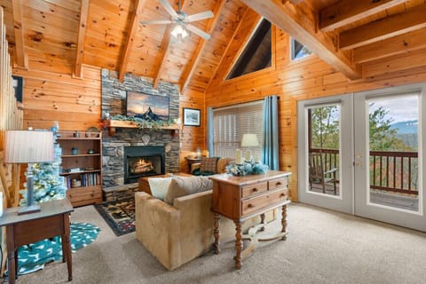 Comfortable furniture, gas fireplace, large Smart TV and lots of natural light make the living room the perfect gathering space.