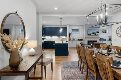 The perfect layout for relaxing with your friends and family. Spacious, yet cozy, this main living area provides a fully stocked kitchen, comfortable leather seating with a TV over the gas fireplace, and a dining table that can seat 10.