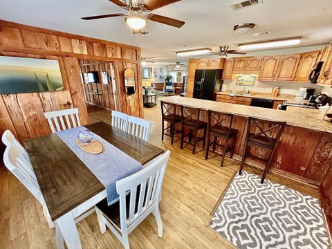 Entrance: Dining, kitchen and living space is set up for entertaining.
