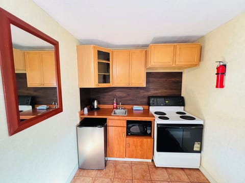 Room, 2 Queen Beds | Private kitchen | Fridge, microwave