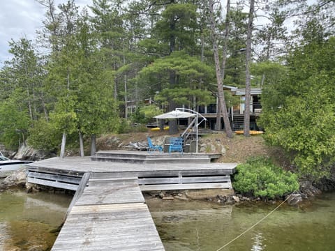 Waterfront Deck and Access to Dock with View of Cottage