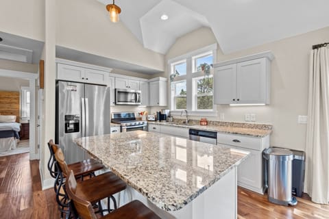 Kitchen with Bar Seating on Third Level