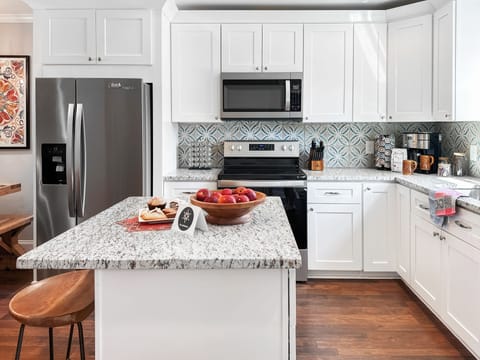 Gourmet kitchen with dine-in island and deluxe coffee bar. Cook up a feast! 