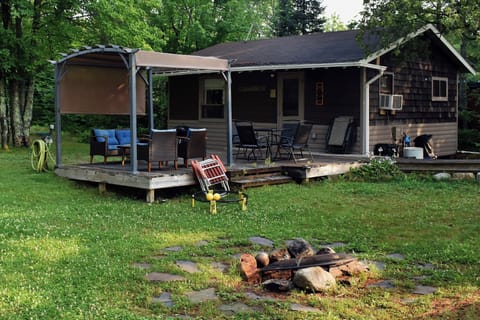 Cabin, pergola, and firepit. 
