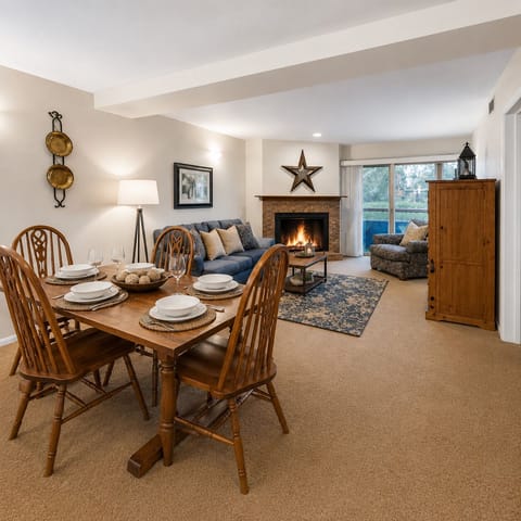 Cozy up by your crackling fireplace in this warm living space where rustic charm meets comfort—perfect for family dinners and relaxing evenings.