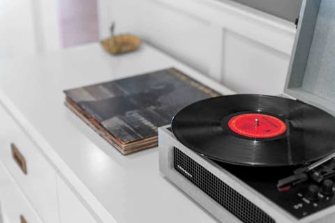 Record Player with plenty of records in the Primary Bedroom