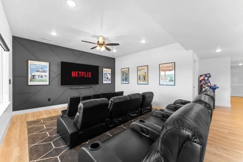 Three rows of movie theater seating with a 75" Big Screen TV and Polk Audio Sounds system for plenty of entertainment 