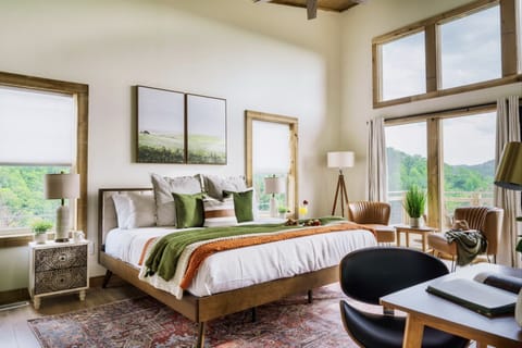 Our spacious bedroom beckons with an open embrace, inviting you into a realm of comfort and style.