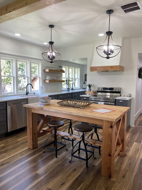 Enjoy this Gorgeous One-of-a-Kind Island with adjustable stools on both sides. 