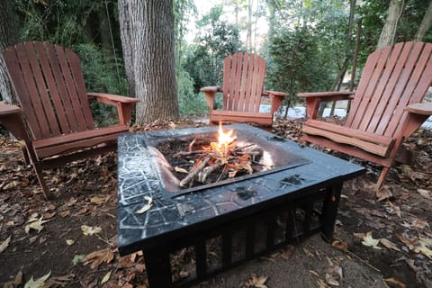 Fire pit out back behind patio 