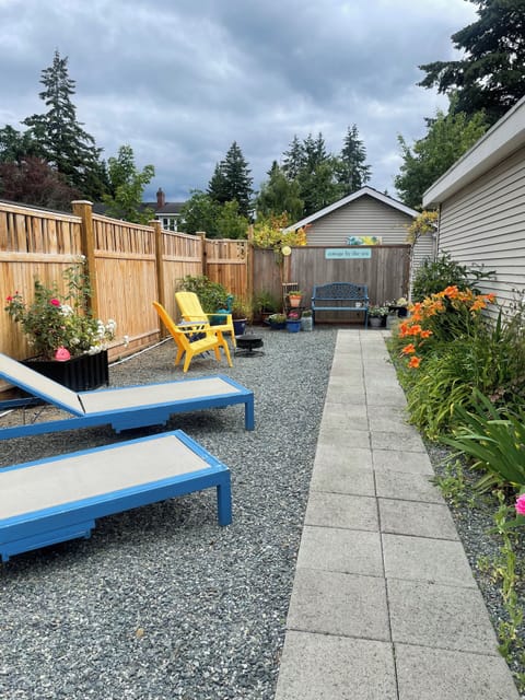 Pathway from gate entrance with lounge chairs. gated and private