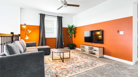 Kick back and relax in our spacious living room, where you can unwind with your favorite book or movie.