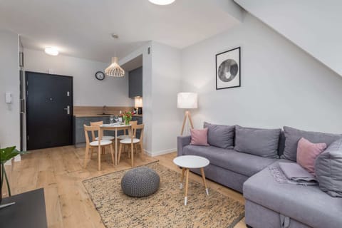Another perspective of the living area, emphasizing the open space and stylish furnishings.