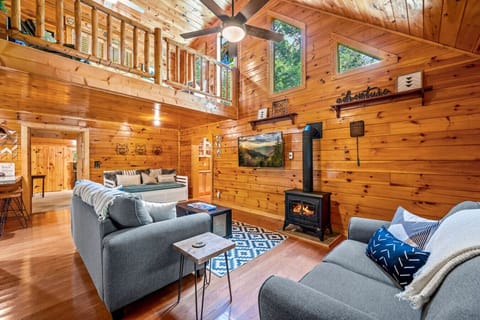 Gorgeous living room area with high ceilings, natural light, comfortable furniture and plenty of space to spread out and relax.