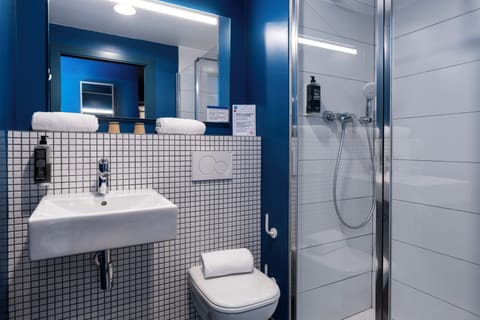 Shower, eco-friendly toiletries, towels, soap