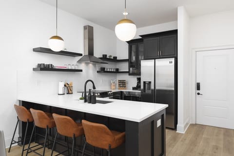 Seating for 4 at the kitchen counter. The kitchen is fully-stocked and ideal for anyone who enjoys cooking & convening.