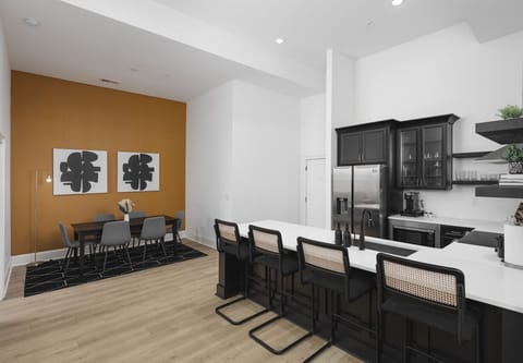 The open floor plan flows from the kitchen to the dining area.