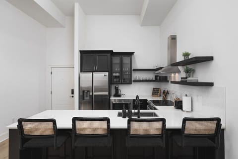 The kitchen is fully stocked with high-end appliances and every utensil, dish, and spice you might need to make a meal. Seating for four available at the counter.