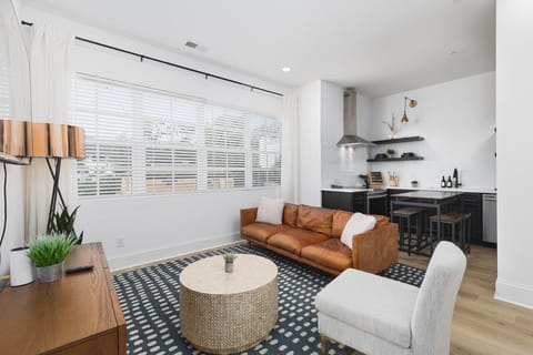 Our cozy living room is a great space to relax, with a comfortable leather couch, lots of natural light, and a Smart TV with all the streaming apps.