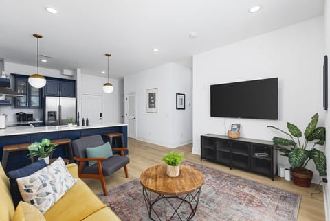 Our cozy living room features a Smart TV with all the streaming apps, a queen-size sleeper sofa, and a balcony to let in the natural light & fresh air.
