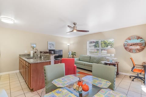 Spacious living room with kitchen table and bar area