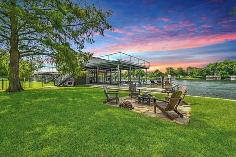 With gorgeous lake views from the deck, water access, grill, and a 2-slip boat dock + 2 space jet ski ramp, you'll never want to check-out!