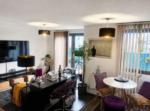 Dining area besides balcony doors with clear floor space and easy access