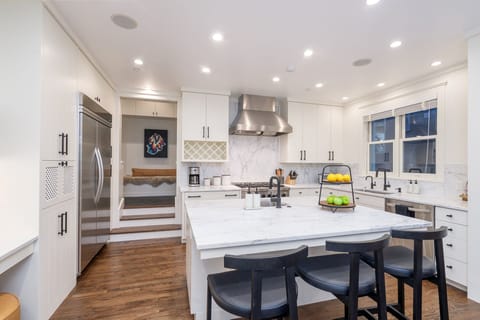 Custom designed High end Kitchen featuring high-quality appliances, elegant finishes and ample storage space.