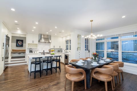 Luxury kitchen with ample entertaining and seating space. Features a Side door leading to the out door patio with gas grill.