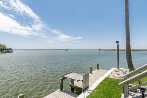 Your private dock awaits with stunning water views and direct bay access for fishing, kayaking, or simply watching boats drift by.