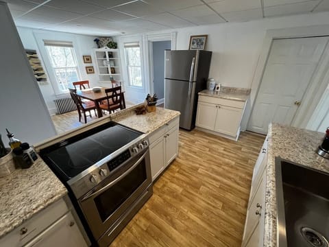 The large open kitchen and dining area are this homes shining gem, a wonderful place to spend time sharing a meal during your getaway. 