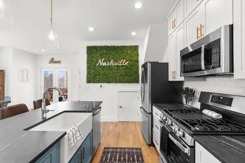 Modern kitchen with stylish decor, a culinary dream with a touch of green.